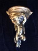 A gold coloured Cherub wall sconce