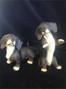 A pair of Dachsund figures