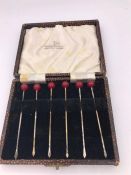 A Boxed set of Walker and Hall silver cocktail sticks