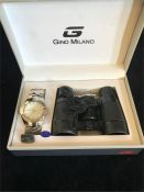 A boxed set of Gina Milano watch and binoculars