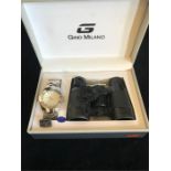 A boxed set of Gina Milano watch and binoculars