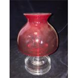 A red glass candle holder
