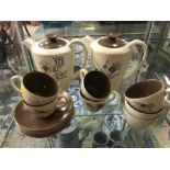 Set of Poole pottery tea cups, saucers and tea pots.