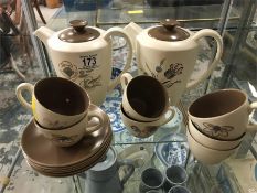 Set of Poole pottery tea cups, saucers and tea pots.