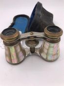 A cased set of mother and pearl 19th Century opera glasses