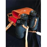 A leather cased set of binoculars
