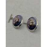 A Pair of Silver and Enamel cufflinks depicting ships at sail.