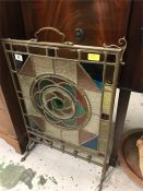 A stained glass fire screen