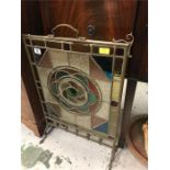 A stained glass fire screen