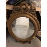 An ornate metal frame mirror