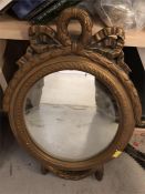 An ornate metal frame mirror