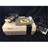 A Nintendo Entertainment System with two controllers and a Super Mario 3 game along with ten others