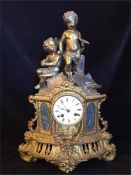 A Gilt cherub themed mantle clock