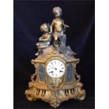 A Gilt cherub themed mantle clock