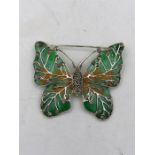 A Silver and Plique A Jour Butterfly Brooch