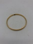 A gold bangle 13.4g