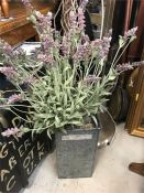 A Faux Lavender plant in metal planter