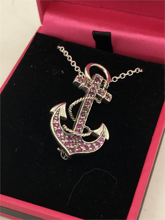 A Silver and Ruby set pendant necklace in the form of an anchor.