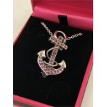 A Silver and Ruby set pendant necklace in the form of an anchor.