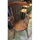 A spindle back fireside chair.