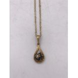 A 9ct gold necklace and pendant