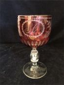 A glass Christening goblet with coin in the stem.