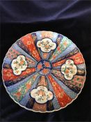 A Large Imari Platter with a scalloped edge.