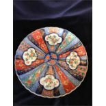 A Large Imari Platter with a scalloped edge.