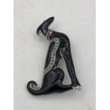 An Impressive silver Art Deco style enamel set dog brooch with ruby collar