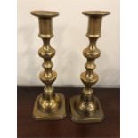 A pair of brass candlesticks