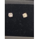 A Pair of 14ct White gold diamond stud earrings of 76 points