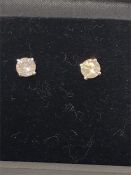 A Pair of 14ct White gold diamond stud earrings of 76 points