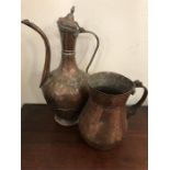 Two hammered copper water jugs