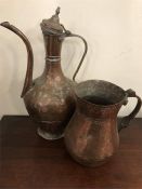 Two hammered copper water jugs