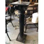 An ebonised column style pedestal