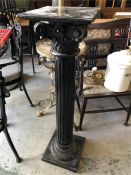 An ebonised column style pedestal