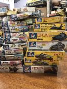 A selection of Italeri models of military vehicles, seventeen in total.