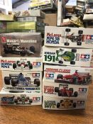 Nine assorted model kits for racing cars