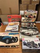 A selection of ten models of cars by Burago, Amt, Bandai, Matchbox etc.