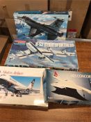 Four large models of commercial and military airplanes by Humbrol, Monogram and Airfix