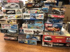 A selection of twenty one model kits for various vehicles by various makers