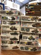 A selection of seventeen model kits for tanks, various makers
