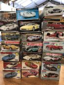 A selection of model car kits twenty one in total