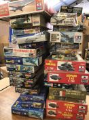 A selection of twenty nine assorted model kits for military planes and tanks