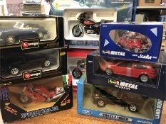 A selection of eight die cast models of cars and motorbikes from various makers