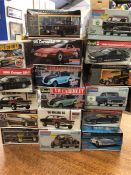 Seventeen model kits for cars by various makers