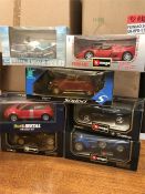 A selection of seven die cast models of cars and a motorbike