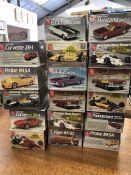 A selection of seventeen model kits for cars