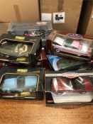A selection of eight large die cast cars by a varierty of makers to include BBURAGO, American