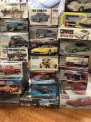 A selection of twenty two model kits for cars by various makers